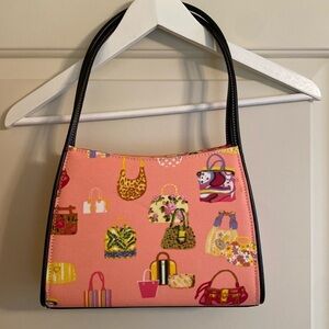 Pink handbag with novelty fun purse print black handles